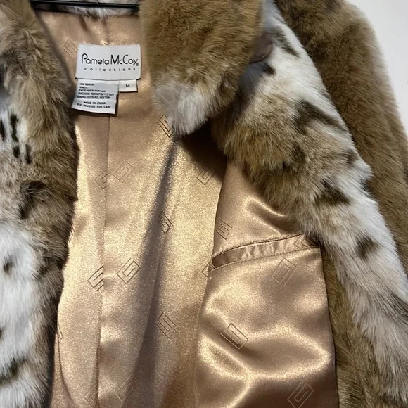 Selling this beautiful Pamela Mccoy fur coat; size Medium. Dry clean only.